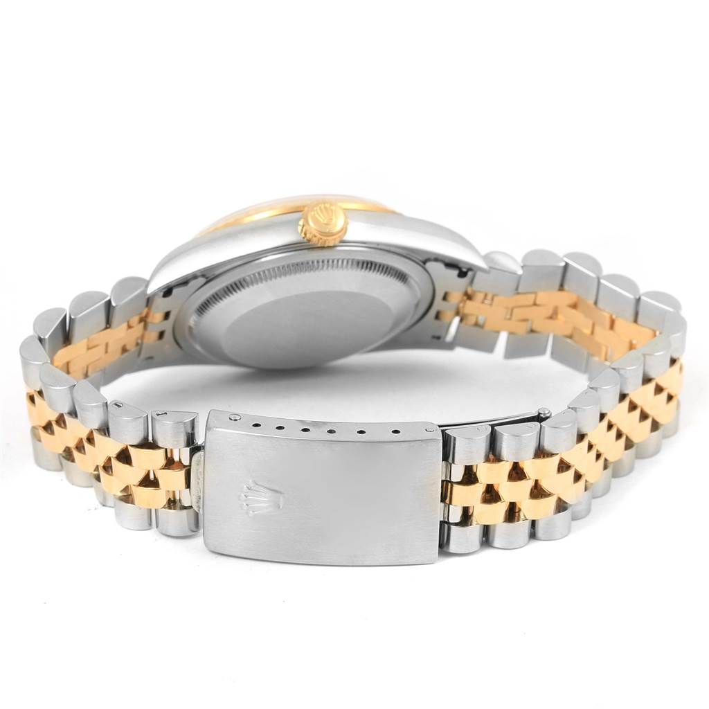 The image shows the back of a Rolex Datejust 16233 Men's Steel and Gold (two tone) White Dial 16233 Men's Steel and Gold (two tone) White Dial watch with its stainless steel and gold jubilee bracelet and closed clasp.