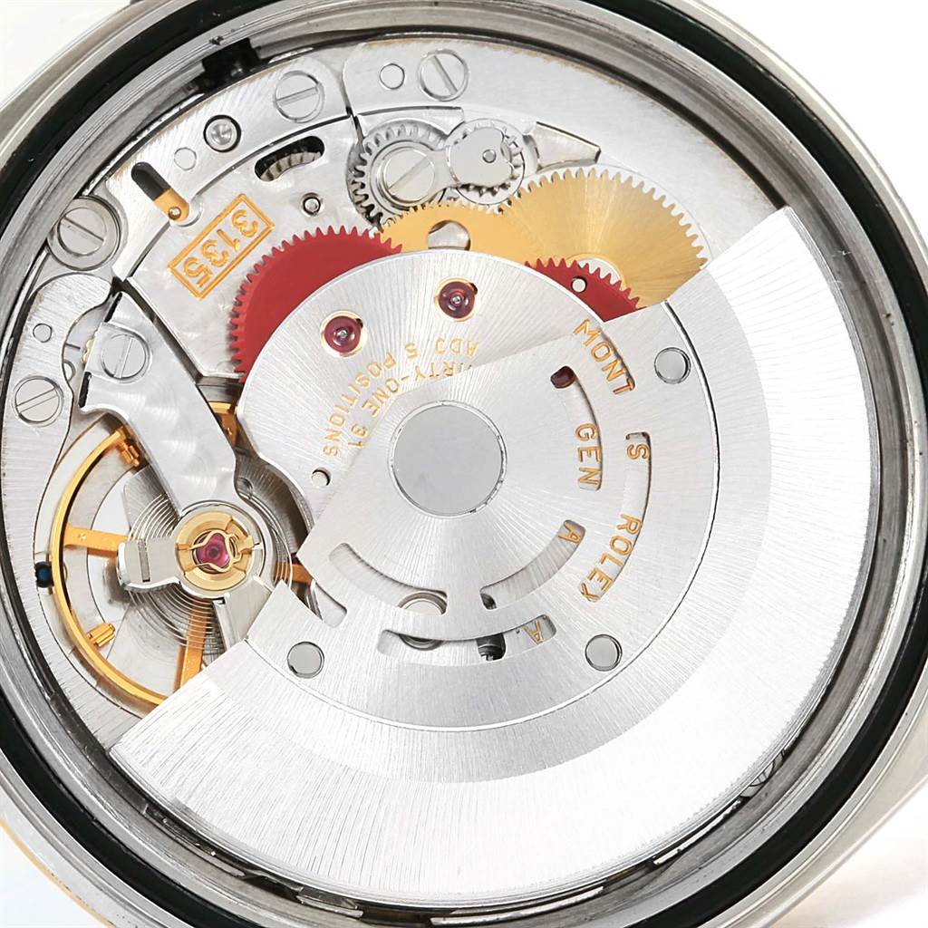 The image shows the intricate internal movement and mechanics of a Rolex Datejust 16233 Men's Steel and Gold (two tone) White Dial 16233 Men's Steel and Gold (two tone) White Dial watch.