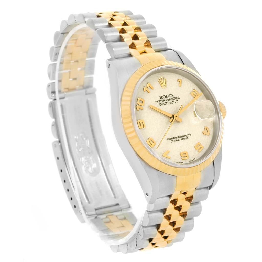The image shows a Rolex Datejust 16233 Men's Steel and Gold (two tone) Beige Dial 16233 Men's Steel and Gold (two tone) Beige Dial watch at a three-quarter angle, highlighting its face, fluted bezel, and two-tone bracelet.