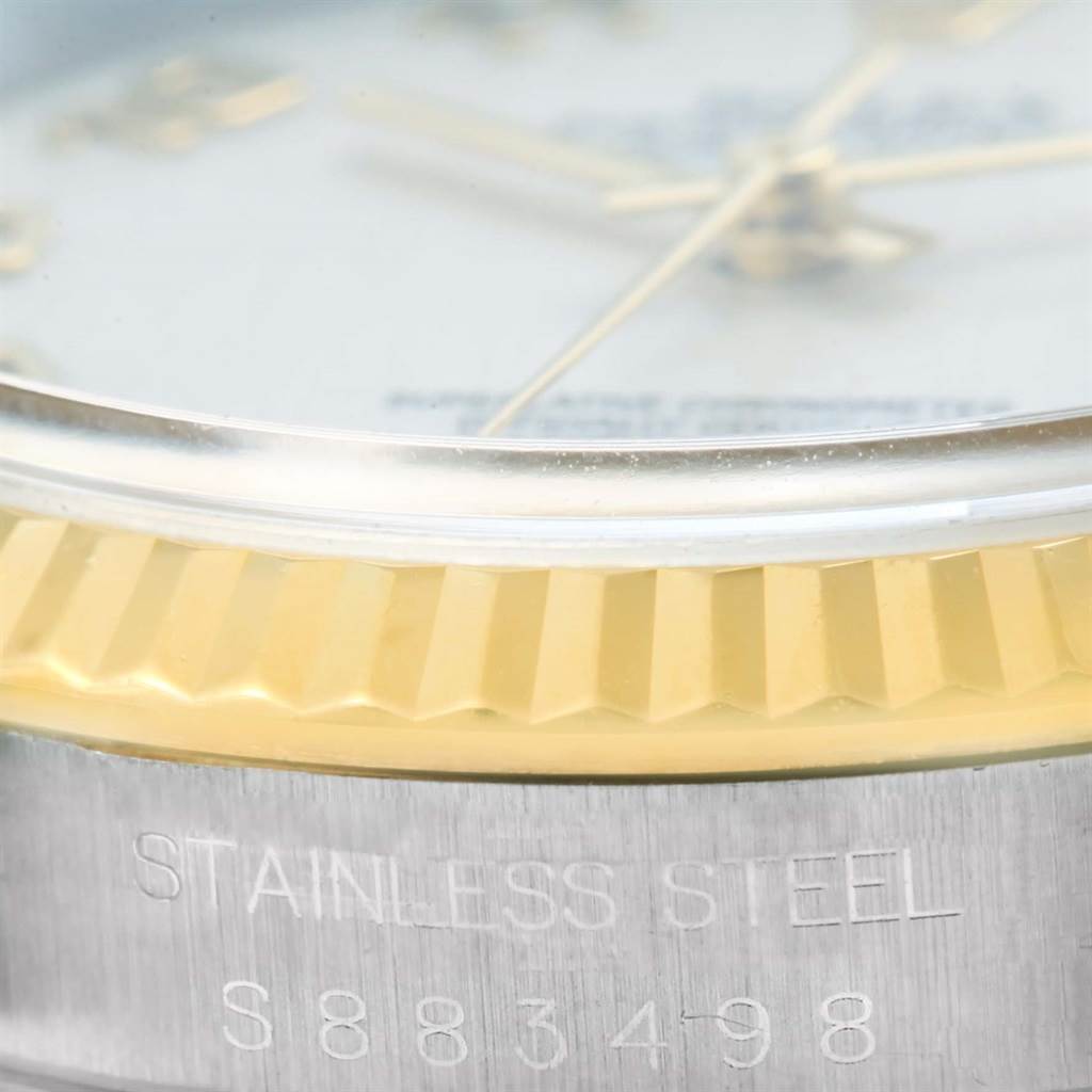 This close-up image of a Rolex Datejust 16233 Men's Steel and Gold (two tone) Beige Dial 16233 Men's Steel and Gold (two tone) Beige Dial watch focuses on the dial, bezel, and case, highlighting the stainless steel and gold details.