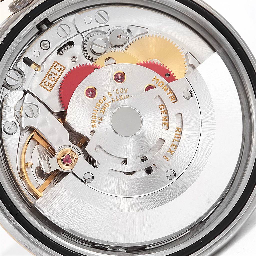 This image shows a close-up view of the movement mechanism of a Rolex Datejust 16233 Men's Steel and Gold (two tone) White Dial 16233 Men's Steel and Gold (two tone) White Dial watch.