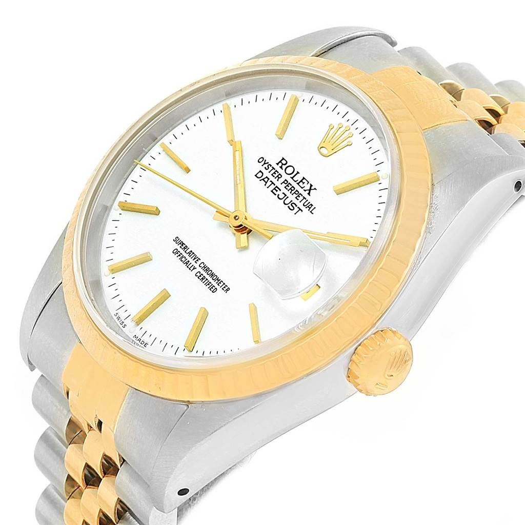 This image shows a Rolex Datejust 16233 Men's Steel and Gold (two tone) White Dial 16233 Men's Steel and Gold (two tone) White Dial watch from an oblique angle, highlighting the face, bezel, and part of the bracelet.