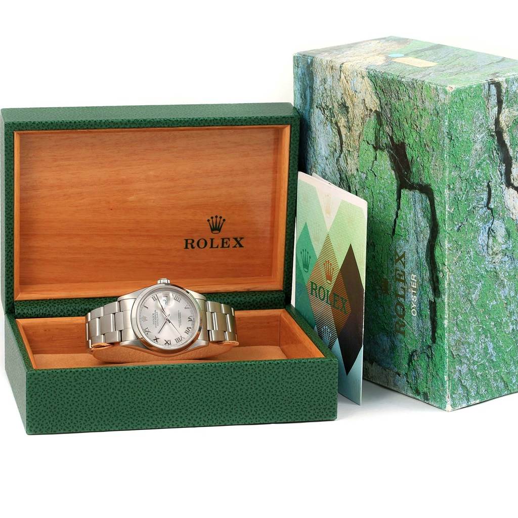 The Rolex Datejust 16200 Men's Stainless Steel Grey Dial 16200 Men's Stainless Steel Grey Dial watch is shown placed inside its open green box with accessories and the outer box visible.