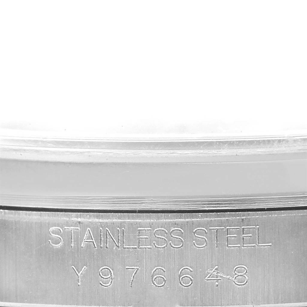 The image shows the side view of a Rolex Datejust 16200 Men's Stainless Steel Grey Dial 16200 Men's Stainless Steel Grey Dial stainless steel watch case, highlighting its serial number.