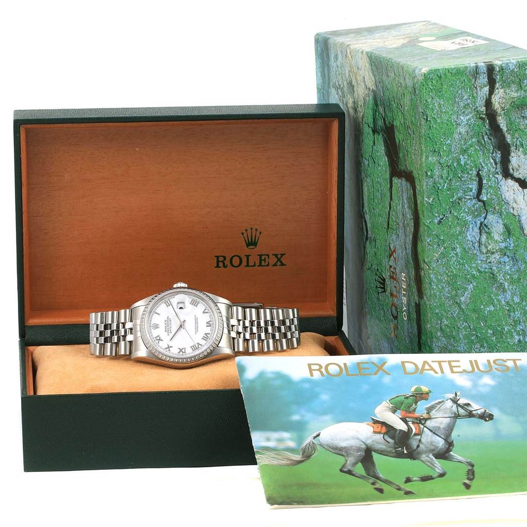 The image shows a Rolex Datejust 16220 Men's Stainless Steel White Dial 16220 Men's Stainless Steel White Dial watch from a front angle, inside its open box with the box cover and manual booklet nearby.