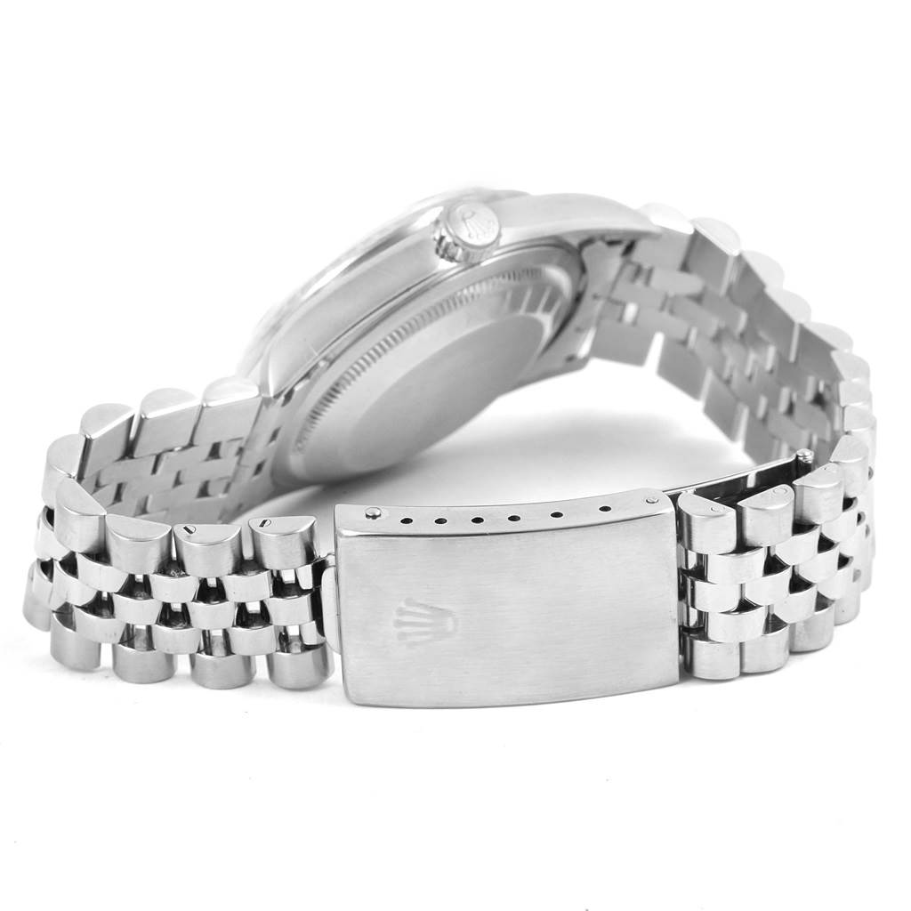 The image shows the back and side view of a Rolex Datejust 16220 Men's Stainless Steel White Dial 16220 Men's Stainless Steel White Dial wristwatch, highlighting its clasp and bracelet.