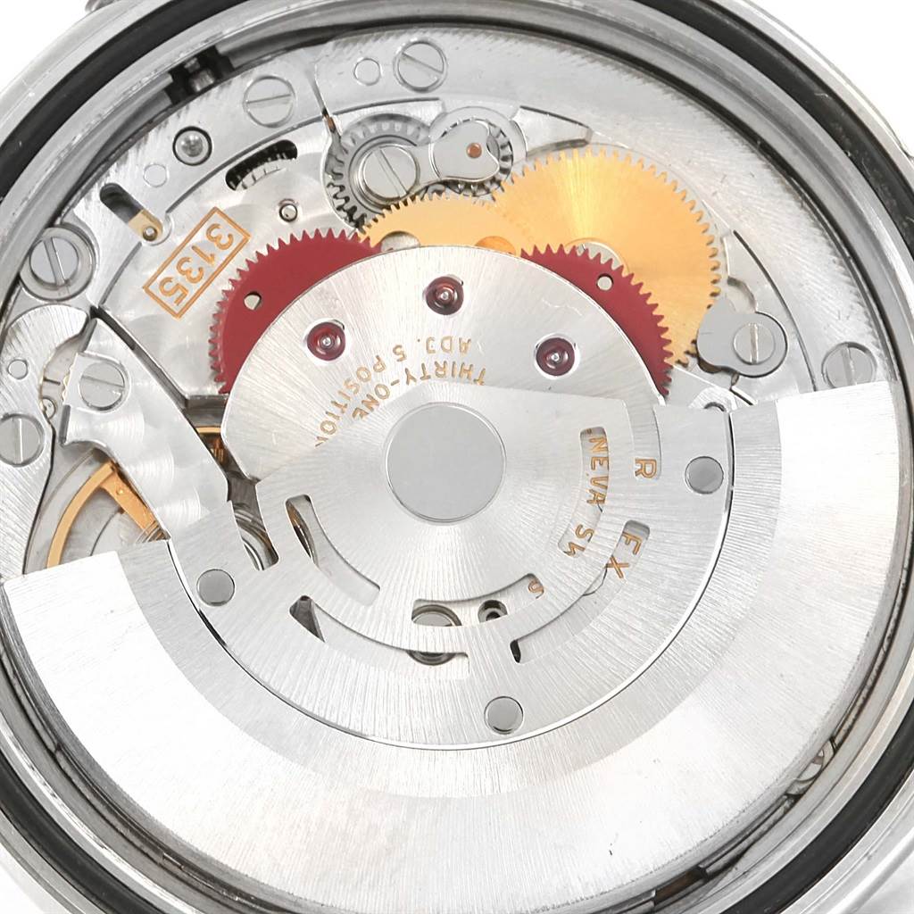 The image shows a close-up of the internal mechanism and movement parts of a Rolex Datejust 16220 Men's Stainless Steel White Dial 16220 Men's Stainless Steel White Dial watch.