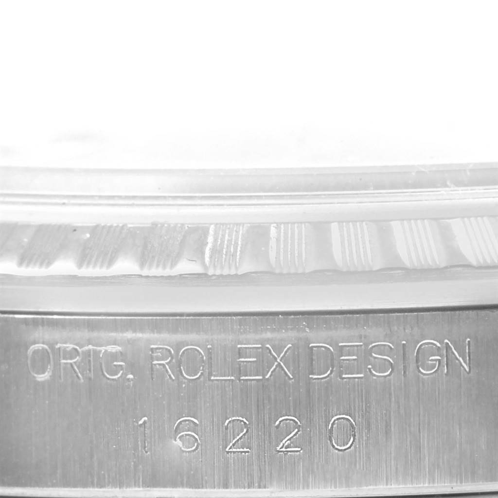 The image shows a close-up of the case side, engraved with "ORIG. ROLEX DESIGN" and the model number 16220 of the Rolex Datejust 16220 Men's Stainless Steel White Dial 16220 Men's Stainless Steel White Dial watch.