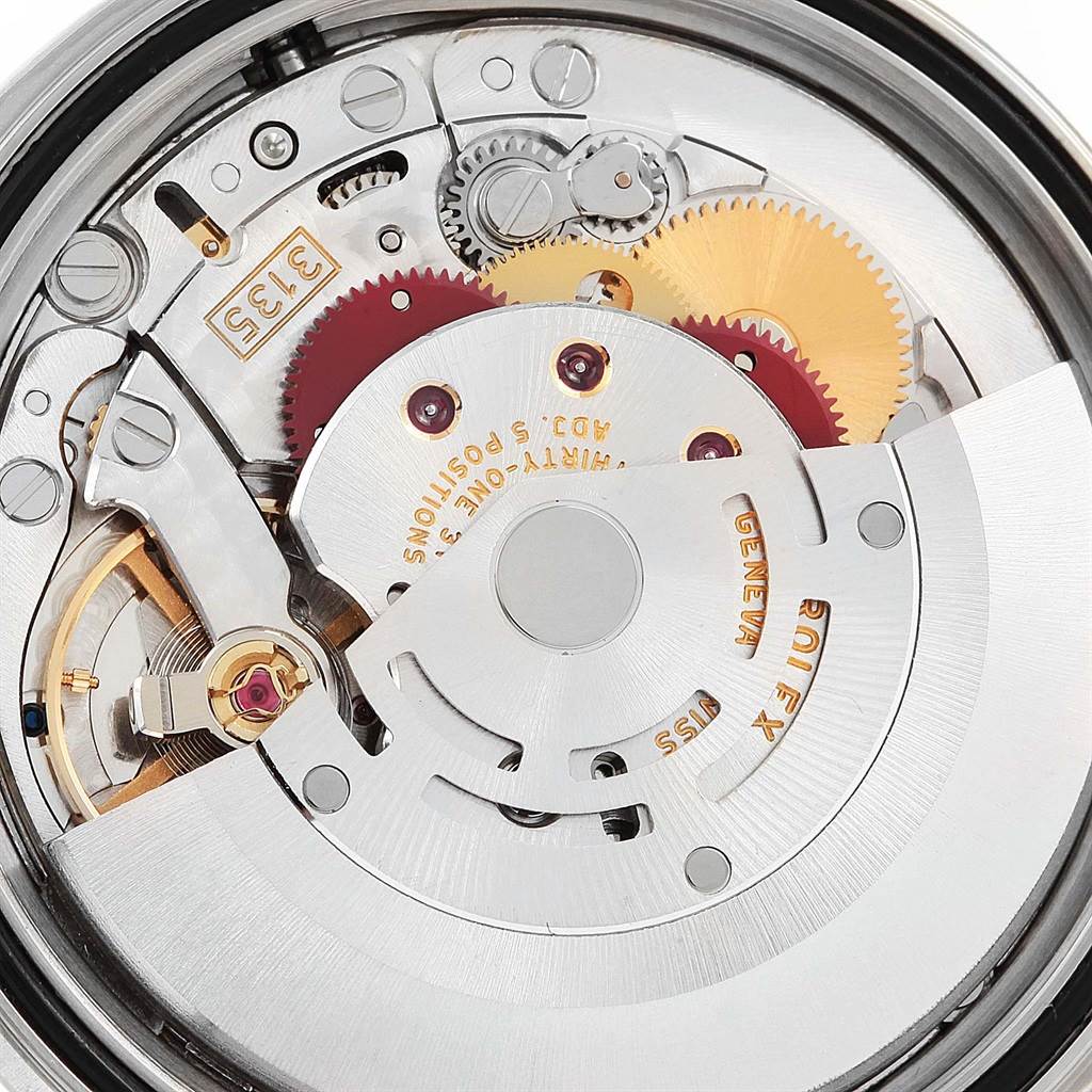 The image shows the internal mechanism of a Rolex Datejust 16200 Men's Stainless Steel Silver Dial 16200 Men's Stainless Steel Silver Dial watch, including gears and the rotor.