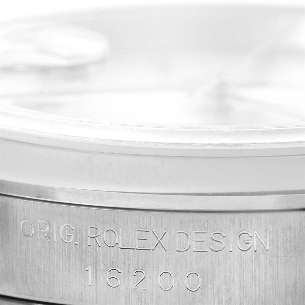 This close-up photo shows a partial view of the dial and case of a Rolex Datejust 16200 Men's Stainless Steel Silver Dial 16200 Men's Stainless Steel Silver Dial, highlighting the inscription "ORIG. ROLEX DESIGN 16200."