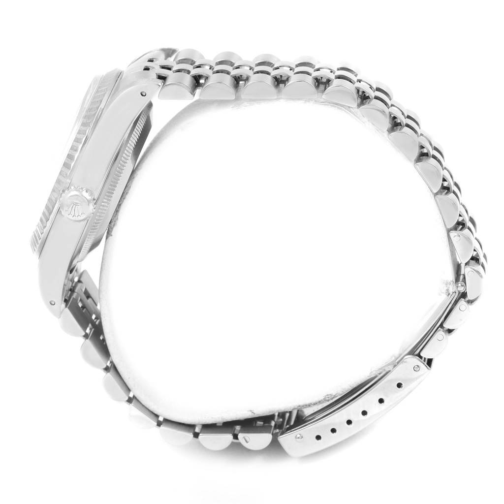 The image shows a side view of the Rolex Datejust 16234 Men's Stainless Steel Silver Dial 16234 Men's Stainless Steel Silver Dial watch, highlighting its crown, case, and bracelet links.