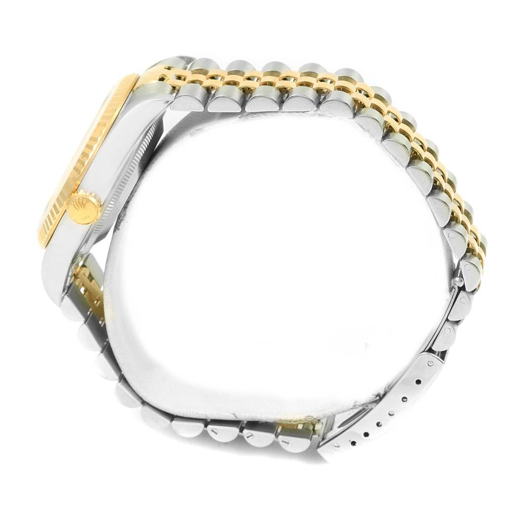 The image shows a side view of a Rolex Datejust 16233 Men's Steel and Gold (two tone) White Dial 16233 Men's Steel and Gold (two tone) White Dial watch, highlighting its gold bezel, crown, and two-tone bracelet.