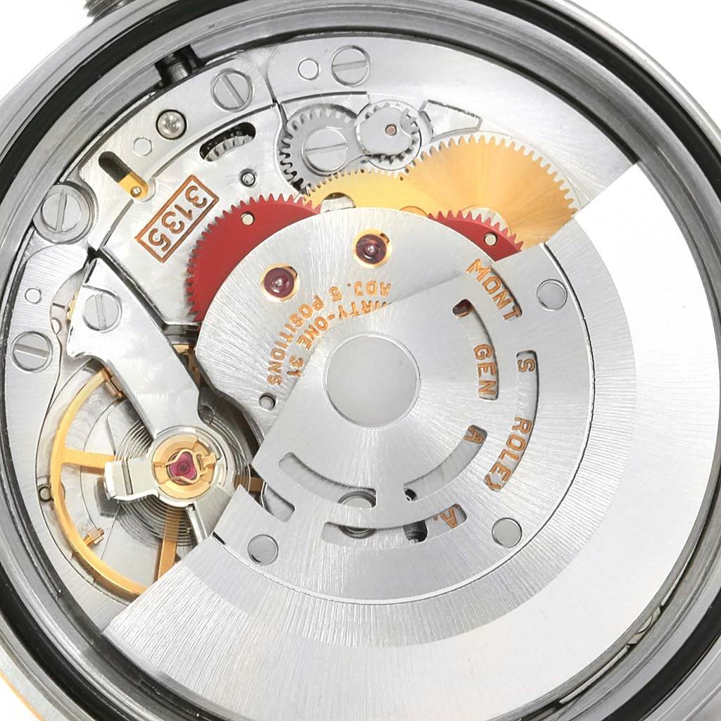 The image shows a close-up view of the movement and inner workings of a Rolex Datejust 16233 Men's Steel and Gold (two tone) White Dial 16233 Men's Steel and Gold (two tone) White Dial watch.