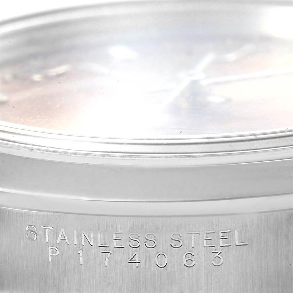 This image shows a close-up of the side of the bezel and part of the case with the serial number on a Rolex Datejust 15200 Men's Stainless Steel Pink Dial 15200 Men's Stainless Steel Pink Dial watch.