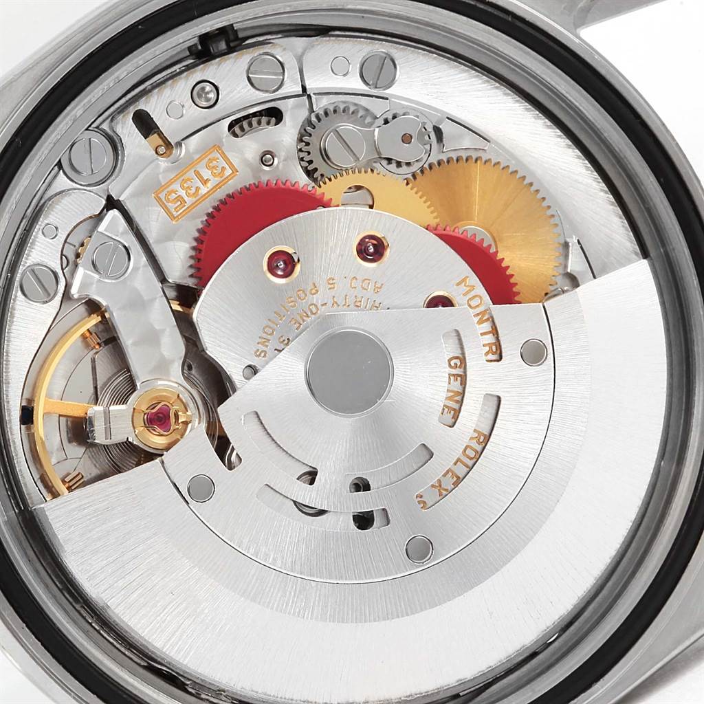 This image shows the internal mechanism of the Rolex Datejust 16220 Men's Stainless Steel Blue Dial 16220 Men's Stainless Steel Blue Dial watch, focusing on the rotor, gears, and movement components.