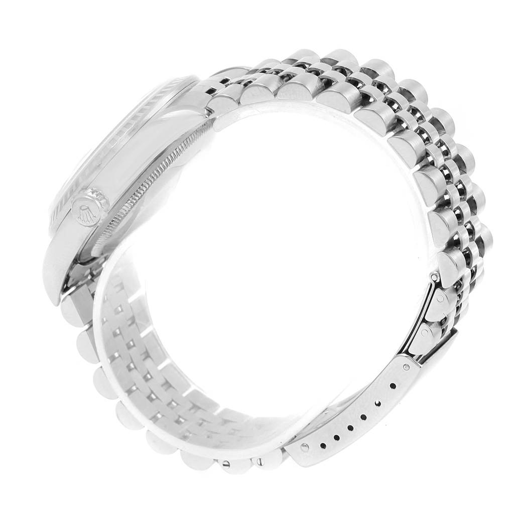 The image shows a side view of a Rolex Datejust 16220 Men's Stainless Steel Blue Dial 16220 Men's Stainless Steel Blue Dial watch focusing on its case, bezel, and a Jubilee bracelet.