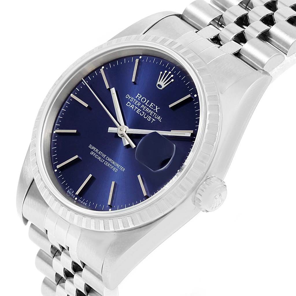 This image shows a Rolex Datejust 16220 Men's Stainless Steel Blue Dial 16220 Men's Stainless Steel Blue Dial watch from a slightly angled side view, highlighting the blue dial, fluted bezel, and stainless steel bracelet.