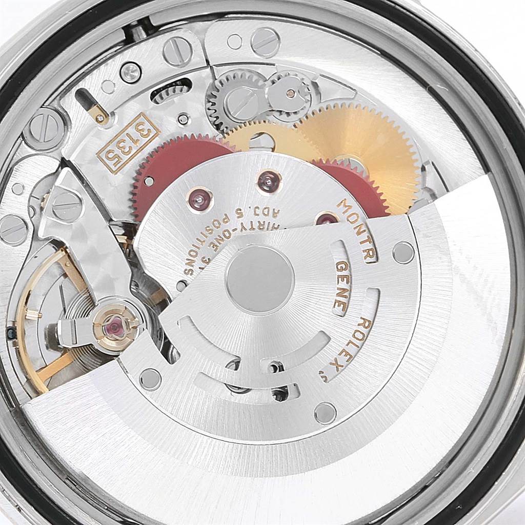 This image shows a close-up view of the movement mechanism of a Rolex Datejust 16234 Men's Stainless Steel Silver Dial 16234 Men's Stainless Steel Silver Dial watch, highlighting gears and internal components.