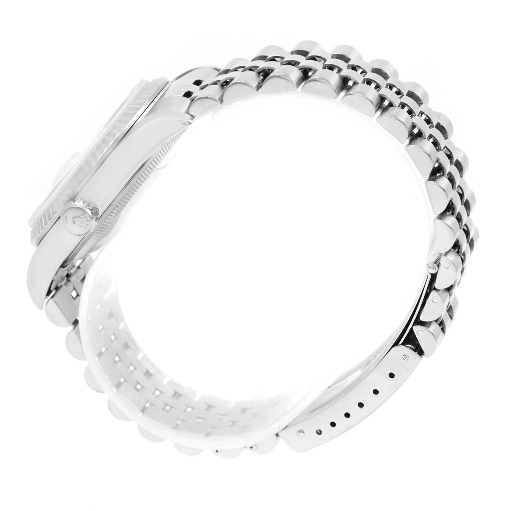 The image shows a side angle of a Rolex Datejust 16234 Men's Stainless Steel Silver Dial 16234 Men's Stainless Steel Silver Dial watch, highlighting the stainless steel bracelet and case.