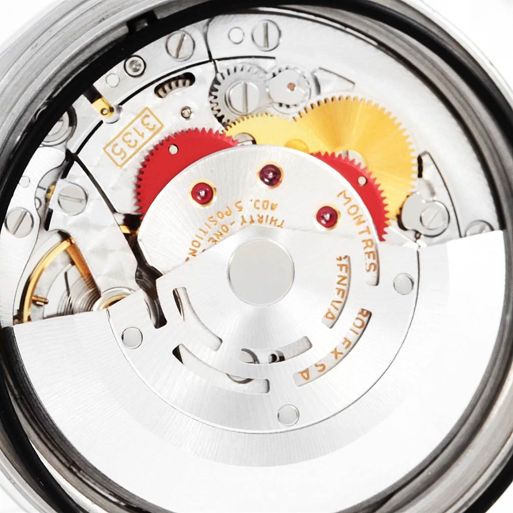 The image shows the internal mechanical parts of a Rolex Datejust 16234 Stainless Steel Silver Dial 16234 Stainless Steel Silver Dial watch, highlighting gears and the rotor.