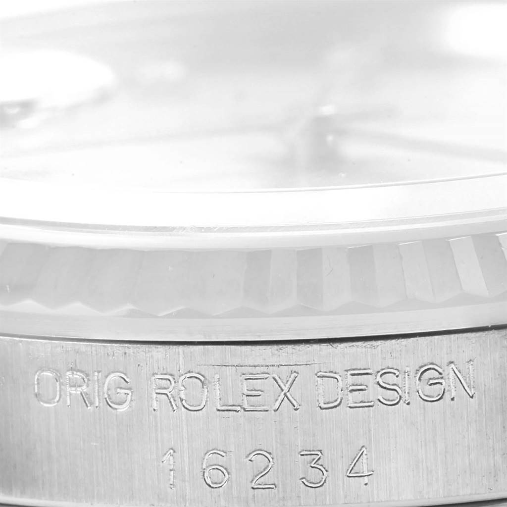 The image shows a close-up of the side of a Datejust model by Rolex, highlighting the bezel and the "ORIG ROLEX DESIGN 16234" engraving.