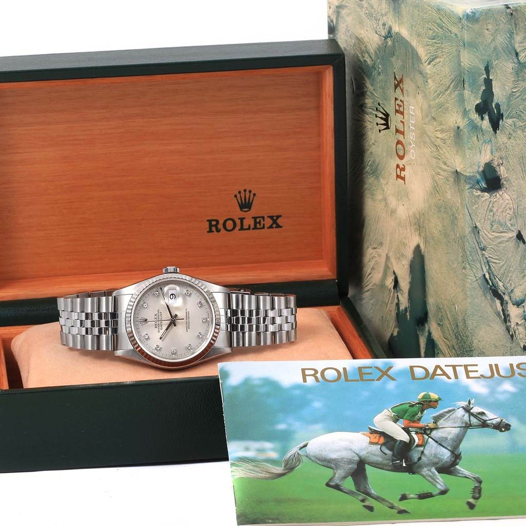 The Rolex Datejust 16234 Stainless Steel Silver Dial 16234 Stainless Steel Silver Dial watch is displayed front-facing in its open box, with the instruction manual visible.