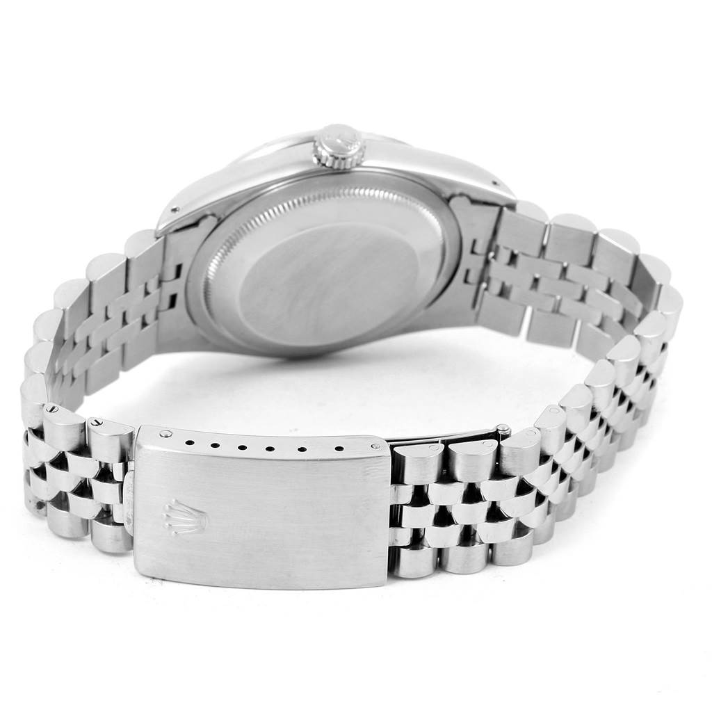 The image shows the back view of a Rolex Datejust 16234 Stainless Steel Silver Dial 16234 Stainless Steel Silver Dial, highlighting its case back, crown, and Jubilee bracelet with the clasp.