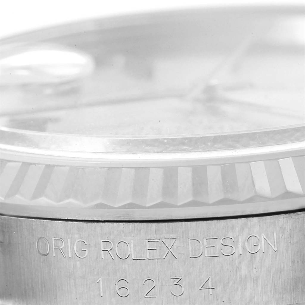The image shows the side view of a Rolex Datejust 16234 Men's Stainless Steel Silver Dial 16234 Men's Stainless Steel Silver Dial watch, highlighting the watch's design and model number engraved on the case.
