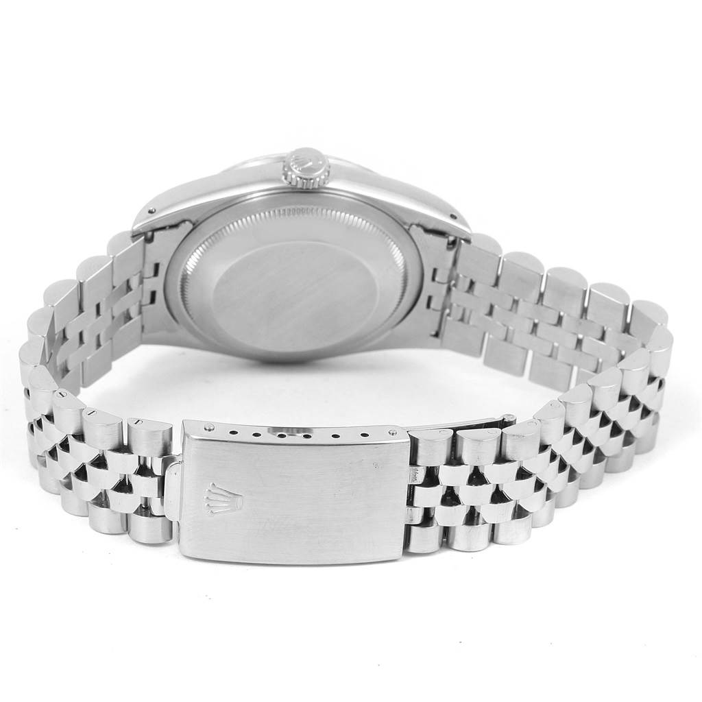 The image shows the back view of a Rolex Datejust 16234 Men's Stainless Steel Silver Dial 16234 Men's Stainless Steel Silver Dial, highlighting its case back, crown, and metal bracelet clasp.