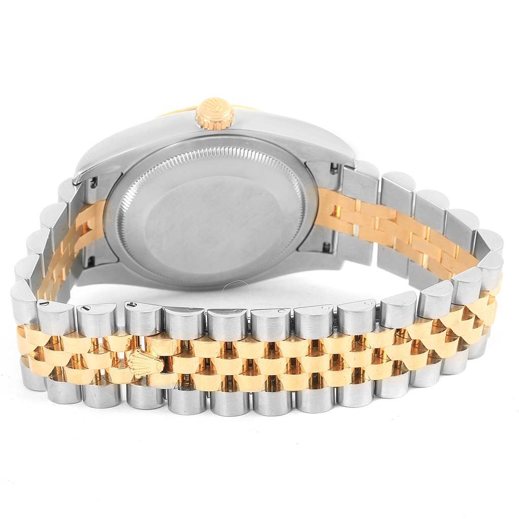 The image shows the backside of the Rolex Datejust 116233 Men's Stainless Steel Champagne Dial 116233 Men's Stainless Steel Champagne Dial watch, highlighting the case back and two-tone bracelet.