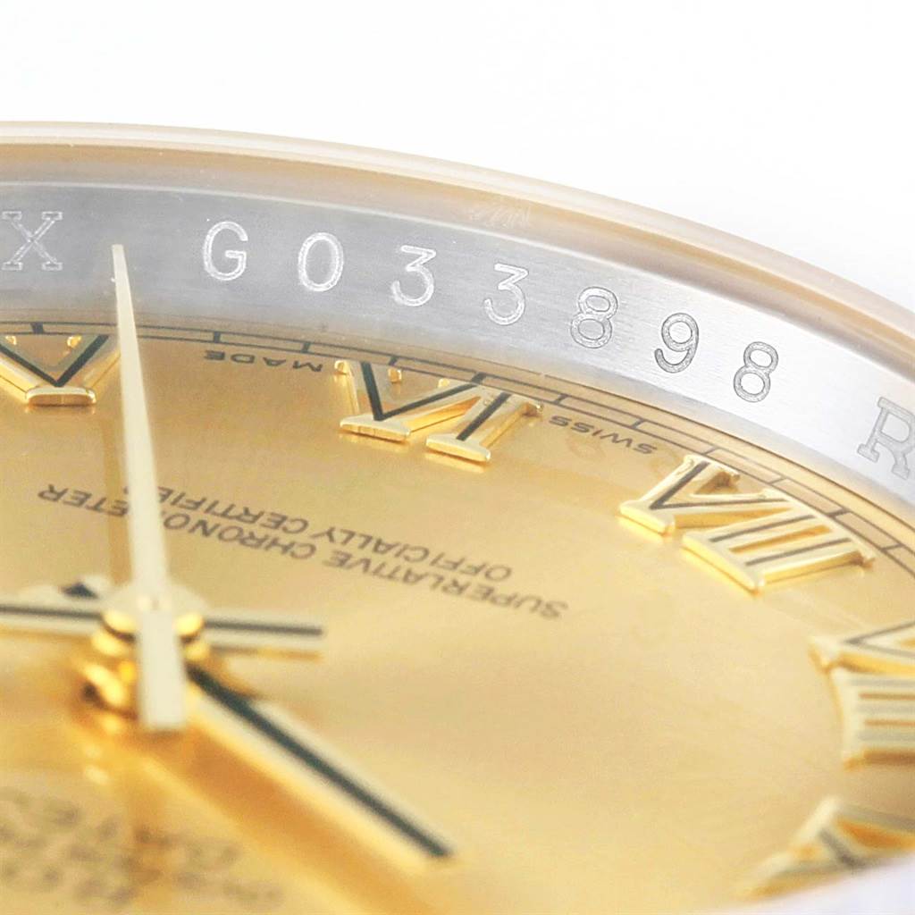 The close-up angle shows the serial number and partial dial of the Rolex Datejust 116233 Men's Stainless Steel Champagne Dial 116233 Men's Stainless Steel Champagne Dial watch, including Roman numerals and hands.