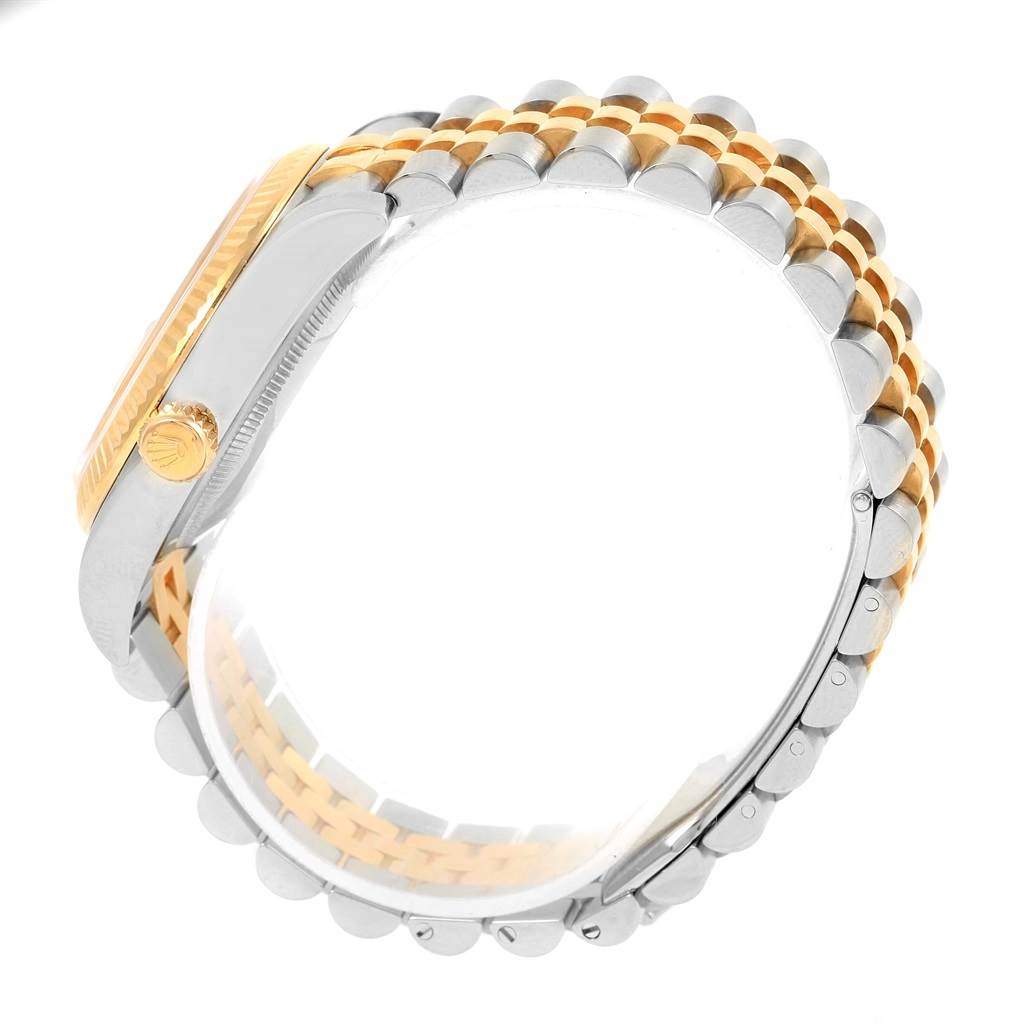 The image shows a side angle of a Rolex Datejust 116233 Men's Stainless Steel Champagne Dial 116233 Men's Stainless Steel Champagne Dial watch, highlighting the gold fluted bezel and two-tone jubilee bracelet.