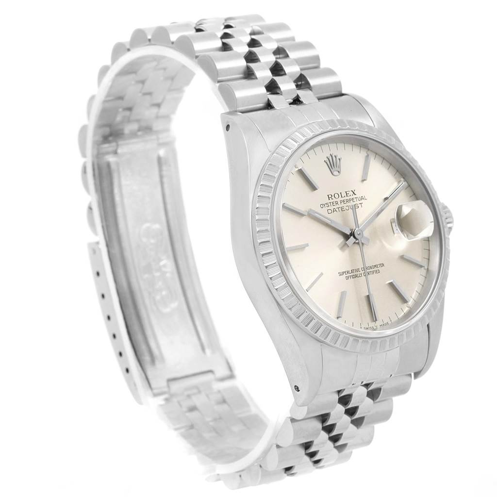 The image shows a Rolex Datejust 16220 Men
s Stainless Steel Silver Dial 16220 Men
s Stainless Steel Silver Dial watch at a side angle, highlighting the face, fluted bezel, and Jubilee bracelet.