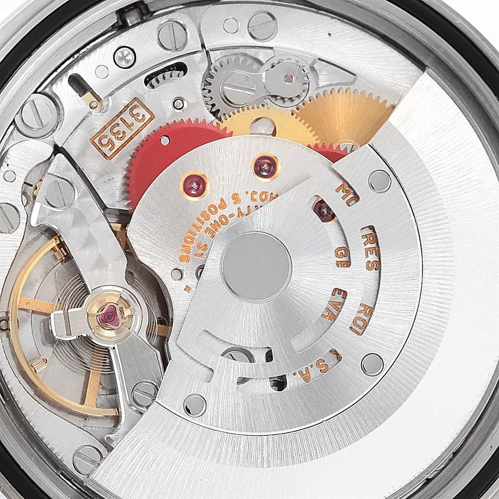 This image shows an up-close view of the mechanical movement inside a Rolex Datejust 16220 Men
s Stainless Steel Silver Dial 16220 Men
s Stainless Steel Silver Dial watch, highlighting its intricate gears and components.
