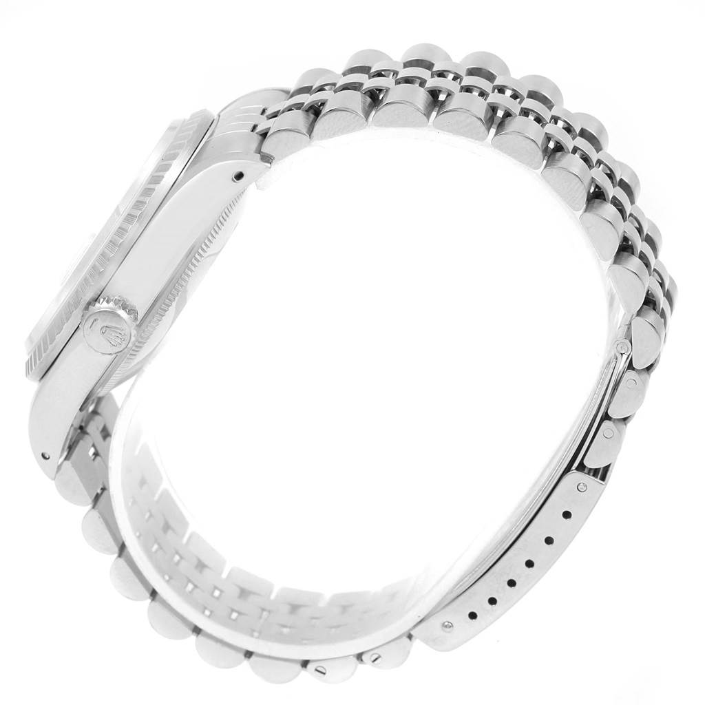 This image shows a side view of a Rolex Datejust 16220 Men
s Stainless Steel Silver Dial 16220 Men
s Stainless Steel Silver Dial watch, highlighting its bracelet and crown.