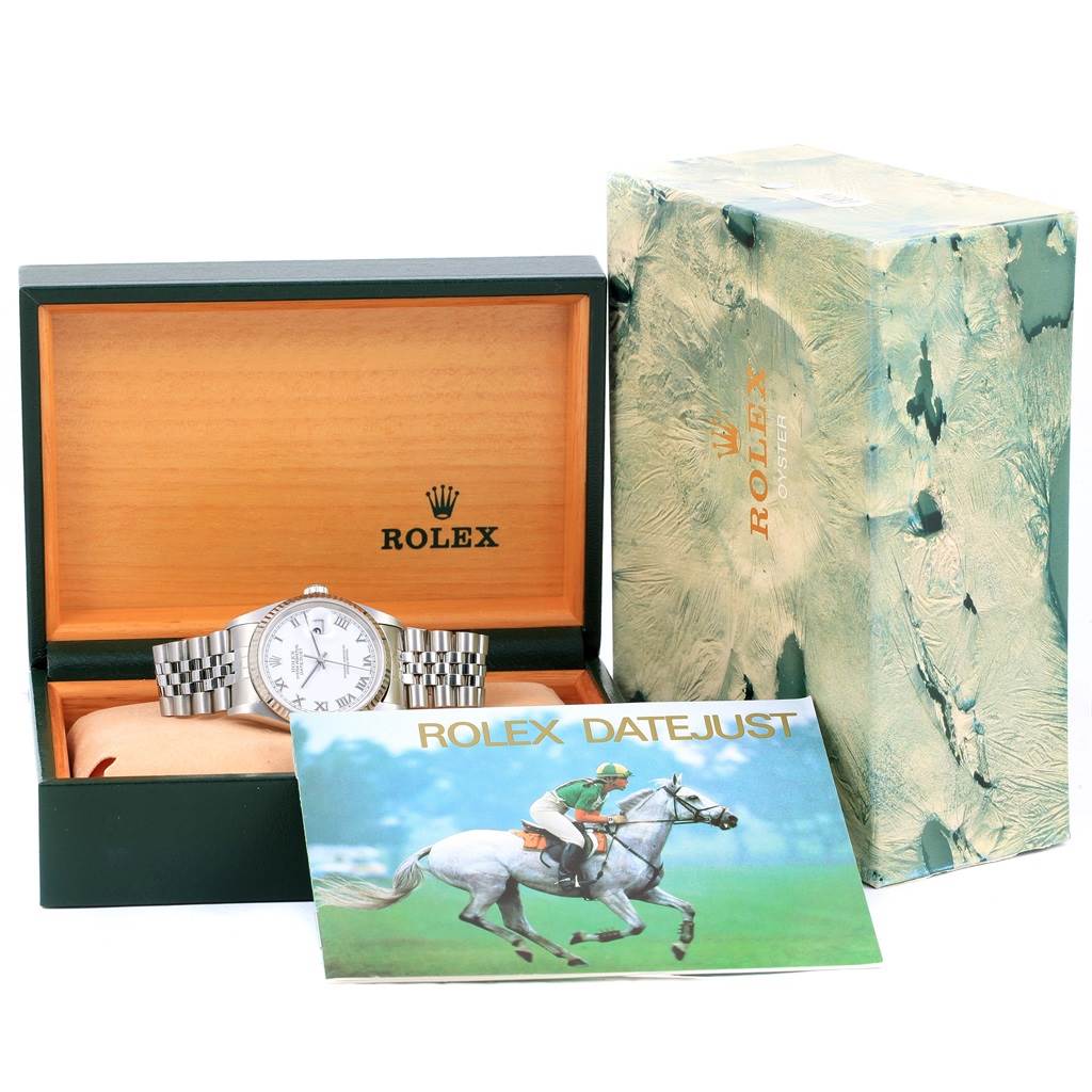 The Rolex Datejust 16234 Men's Stainless Steel White Dial 16234 Men's Stainless Steel White Dial watch is displayed front-facing in its open box, alongside its outer box and a brochure.