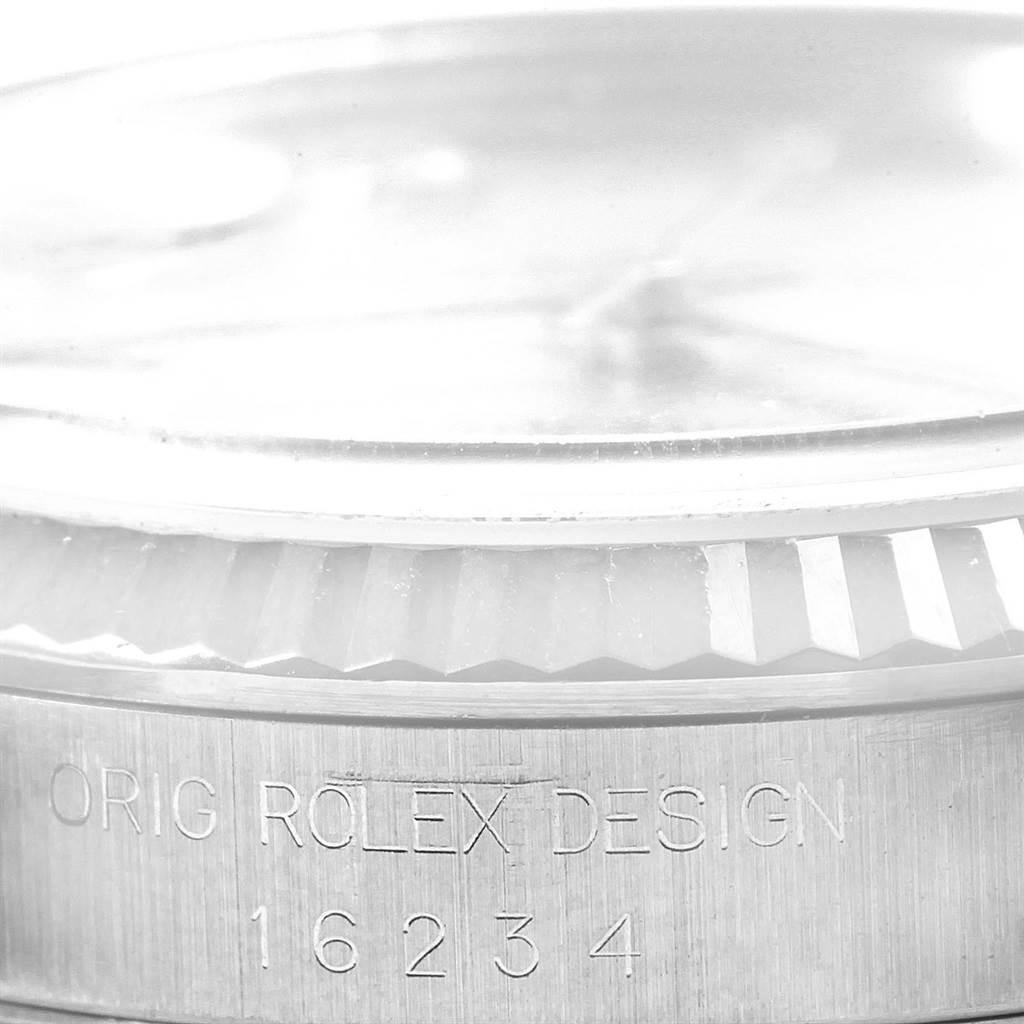This image shows a close-up of the side and bezel of a Rolex Datejust 16234 Men's Stainless Steel Silver Dial 16234 Men's Stainless Steel Silver Dial watch, with the model number 16234 engraved.