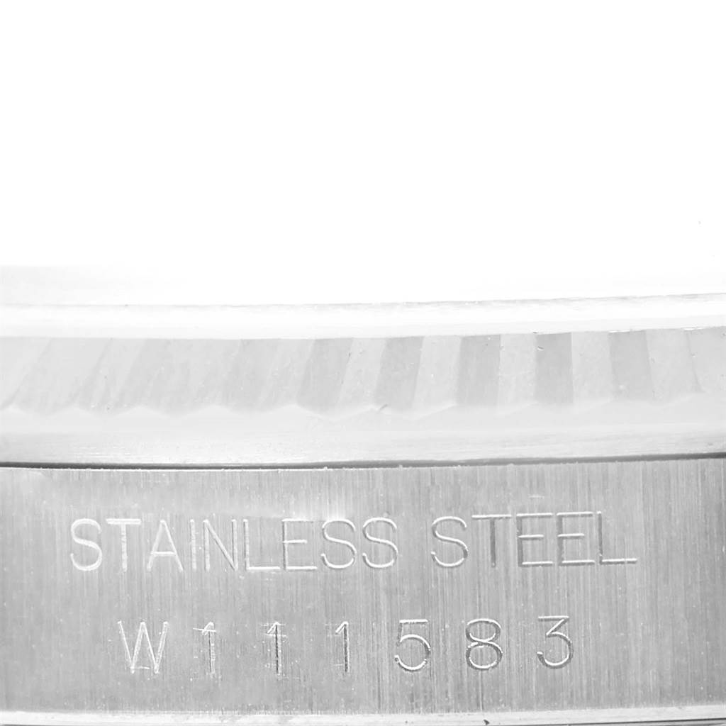 This image shows a close-up of the engraved stainless steel part and serial number of the Rolex Datejust 16234 Men's Stainless Steel Silver Dial 16234 Men's Stainless Steel Silver Dial watch.