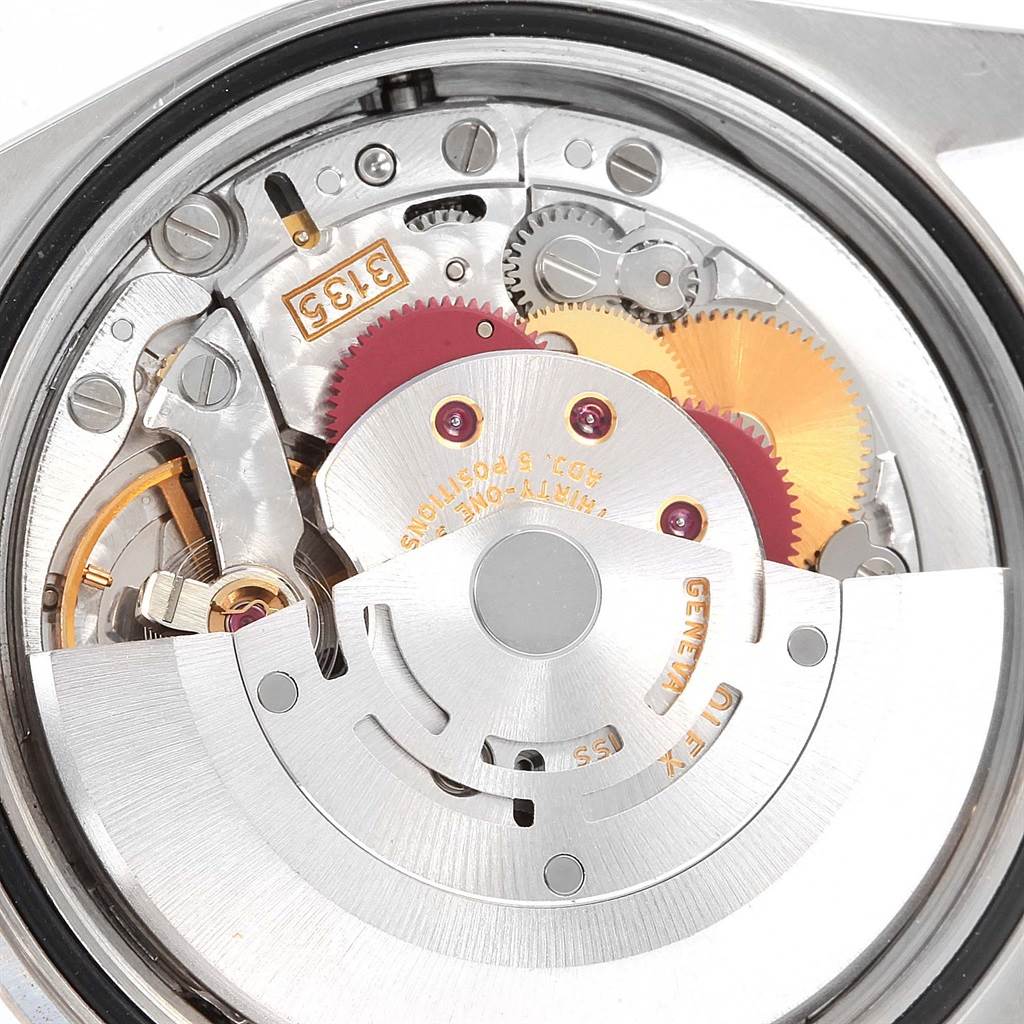 This is an image of the Rolex Datejust 16234 Men's Stainless Steel Silver Dial 16234 Men's Stainless Steel Silver Dial movement mechanism, showing the intricate inner components from the back.