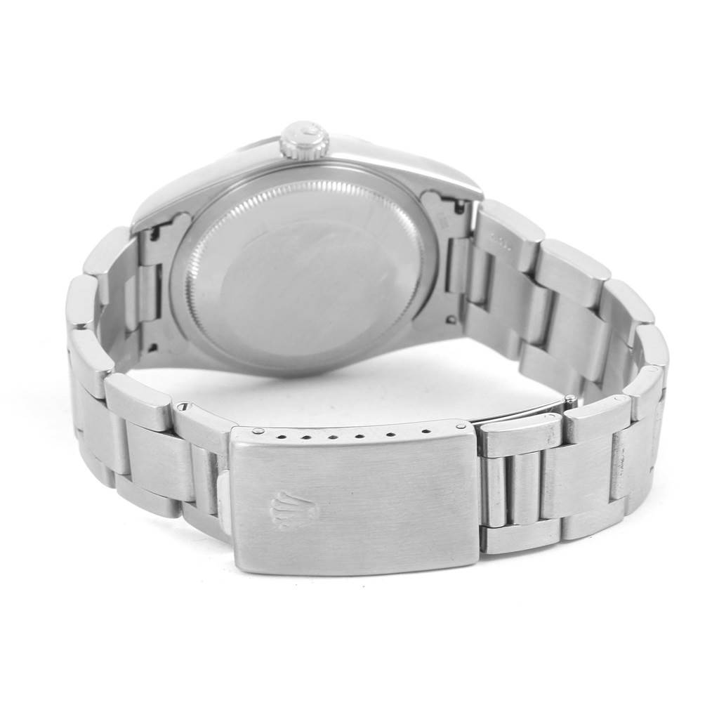 The image shows the back view of a Rolex Datejust 16234 Men's Stainless Steel Silver Dial 16234 Men's Stainless Steel Silver Dial watch, displaying the clasp, bracelet links, and the case back.