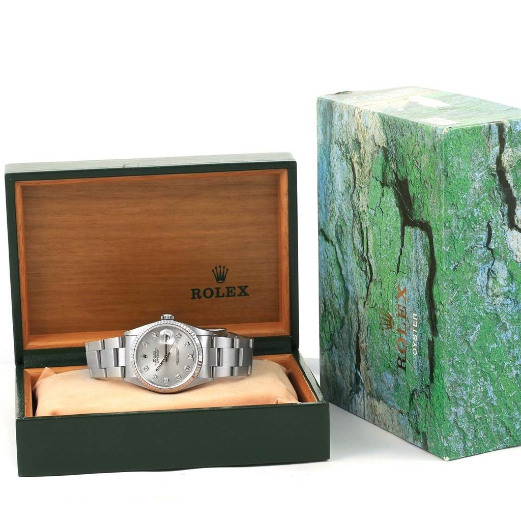 The image shows a Rolex Datejust 16234 Men's Stainless Steel Silver Dial 16234 Men's Stainless Steel Silver Dial watch with its stainless steel bracelet, housed in an open Rolex box with the outer packaging beside it.