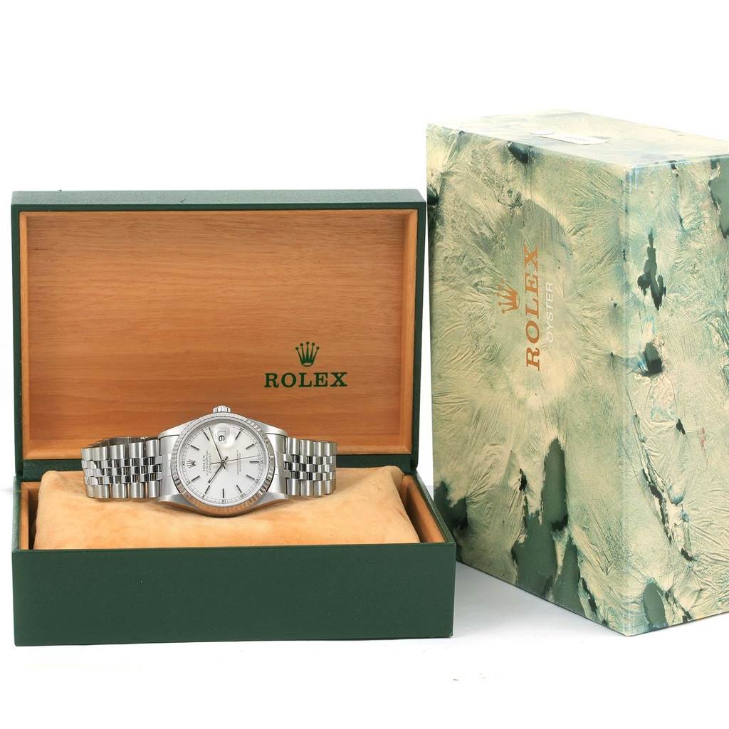 This image shows a Rolex Datejust 16234 Men's Stainless Steel Silver Dial 16234 Men's Stainless Steel Silver Dial watch inside its open wooden box with an additional outer box displayed beside it.