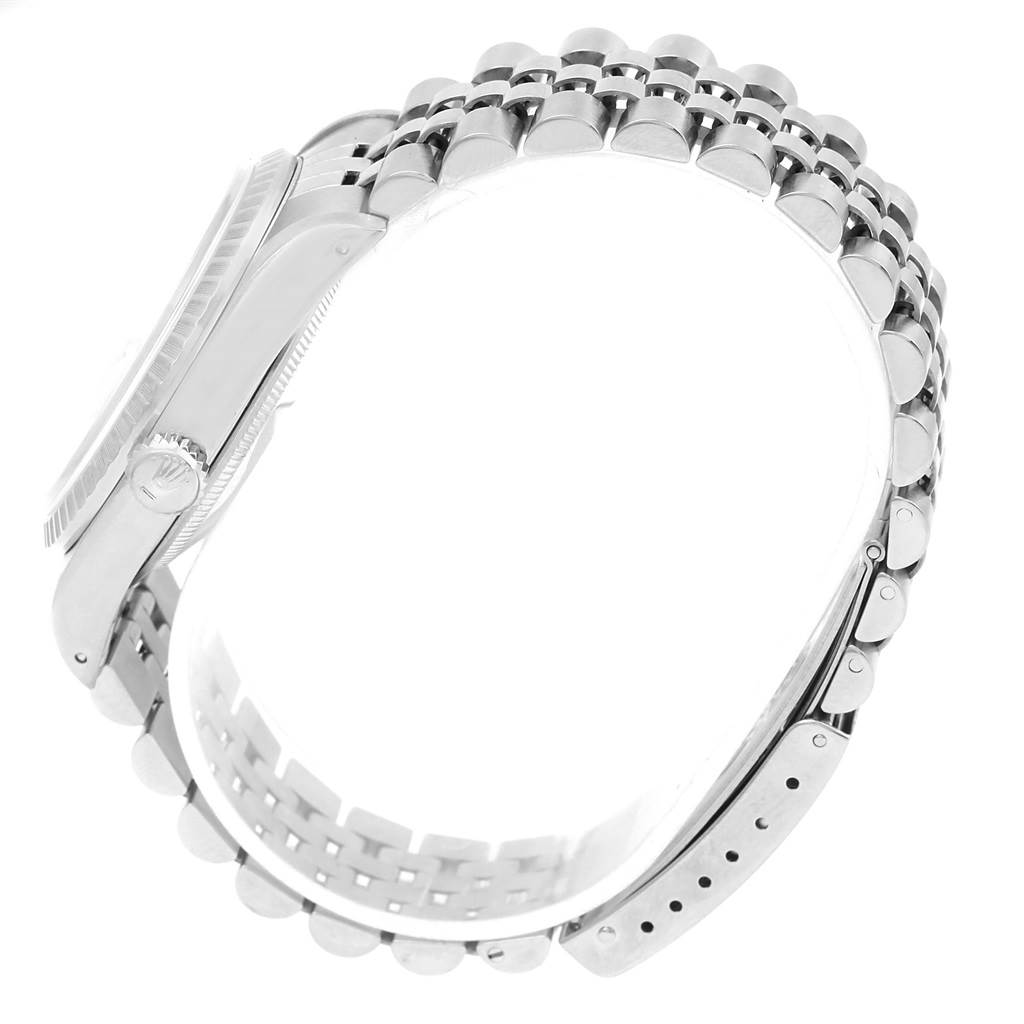 The image shows the side view of a Rolex Datejust 16220 Men's Stainless Steel Silver Dial 16220 Men's Stainless Steel Silver Dial watch, highlighting the case, crown, and Jubilee bracelet.