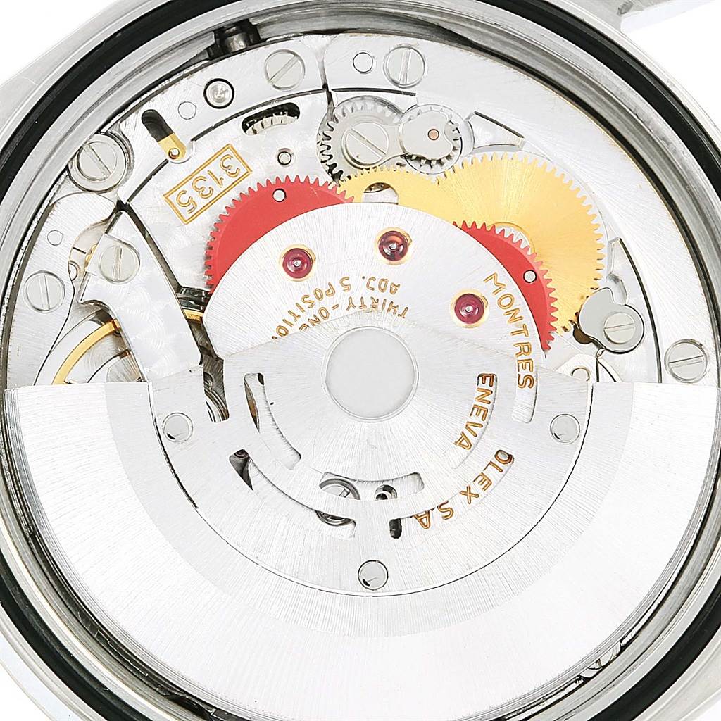 This is an internal view of a Rolex Datejust 16234 Men's Stainless Steel Silver Dial 16234 Men's Stainless Steel Silver Dial watch, showing its intricate movement and gears.