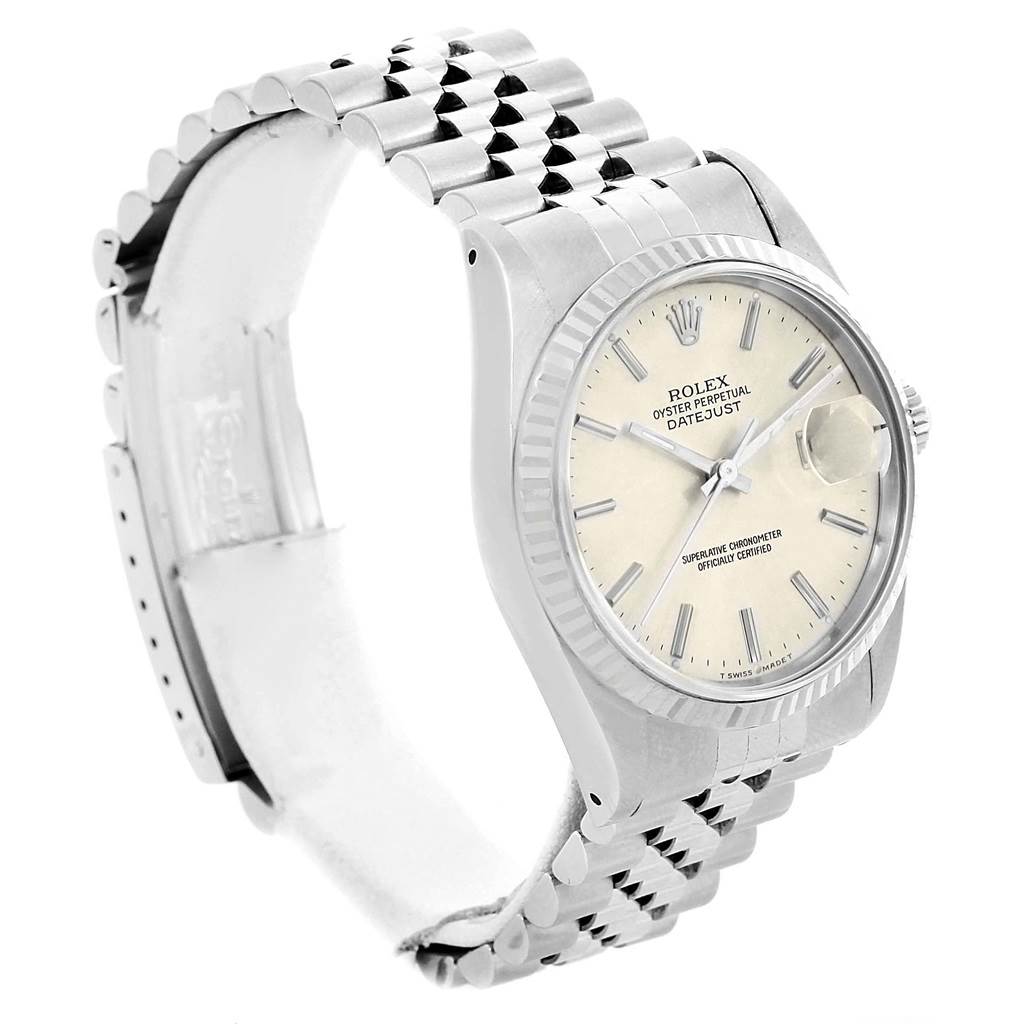 This image shows a left side angle of a Rolex Datejust 16234 Men's Stainless Steel Silver Dial 16234 Men's Stainless Steel Silver Dial watch, featuring its dial, bezel, case, and bracelet.