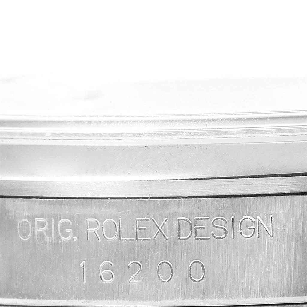 The image shows a close-up angle of the engraved case side of a Rolex Datejust 16200 Men's Stainless Steel Silver Dial 16200 Men's Stainless Steel Silver Dial model, revealing "ORIG. ROLEX DESIGN 16200."