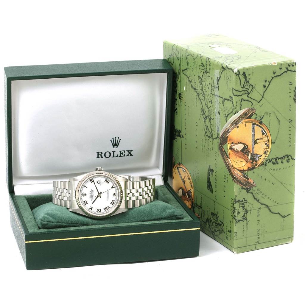 The Rolex Datejust 16234 Men's Stainless Steel White Dial 16234 Men's Stainless Steel White Dial watch is shown from the front in its open box, next to the green branded packaging.