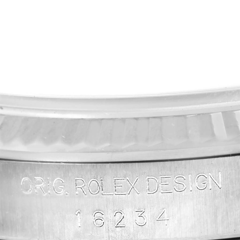 The image shows a close-up of the model number "16234" engraved on the side of a Rolex Datejust 16234 Men's Stainless Steel White Dial 16234 Men's Stainless Steel White Dial watch case.