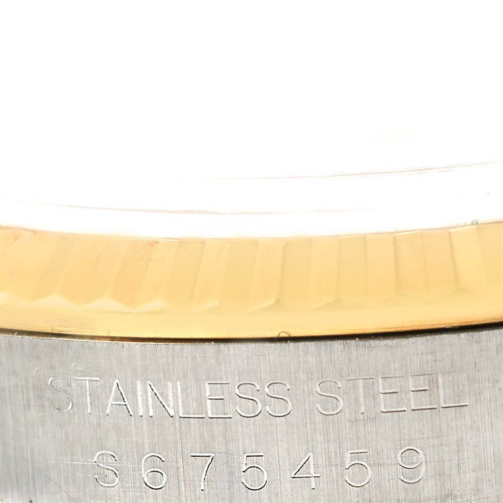 This image shows a close-up of the bezel and case, featuring the serial number of a Rolex Datejust 16233 Steel and Gold (two tone) White Dial 16233 Steel and Gold (two tone) White Dial watch.