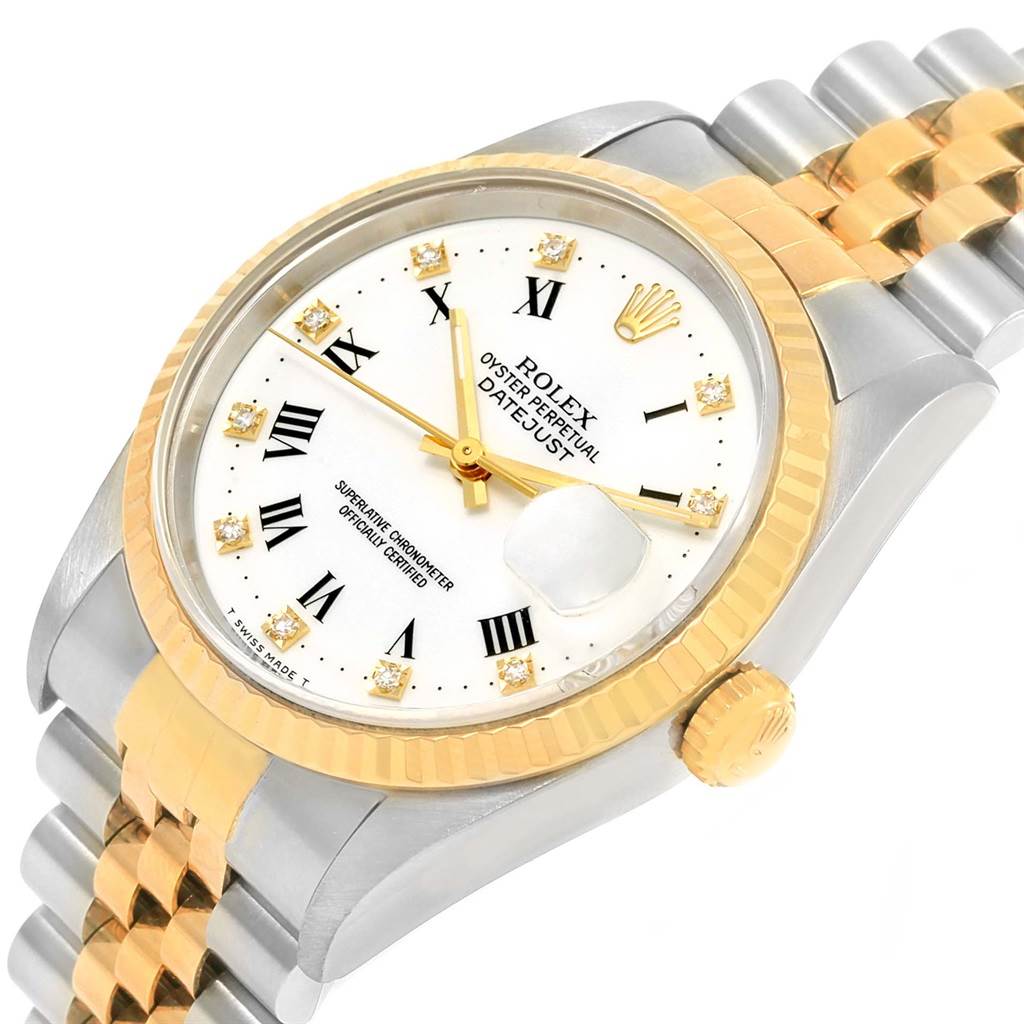 The image shows a Rolex Datejust 16233 Steel and Gold (two tone) White Dial 16233 Steel and Gold (two tone) White Dial watch from an angled top view, highlighting its gold bezel, white dial, and two-tone bracelet.
